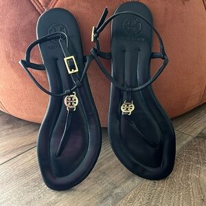 Black with gold Tori Burch sandal.